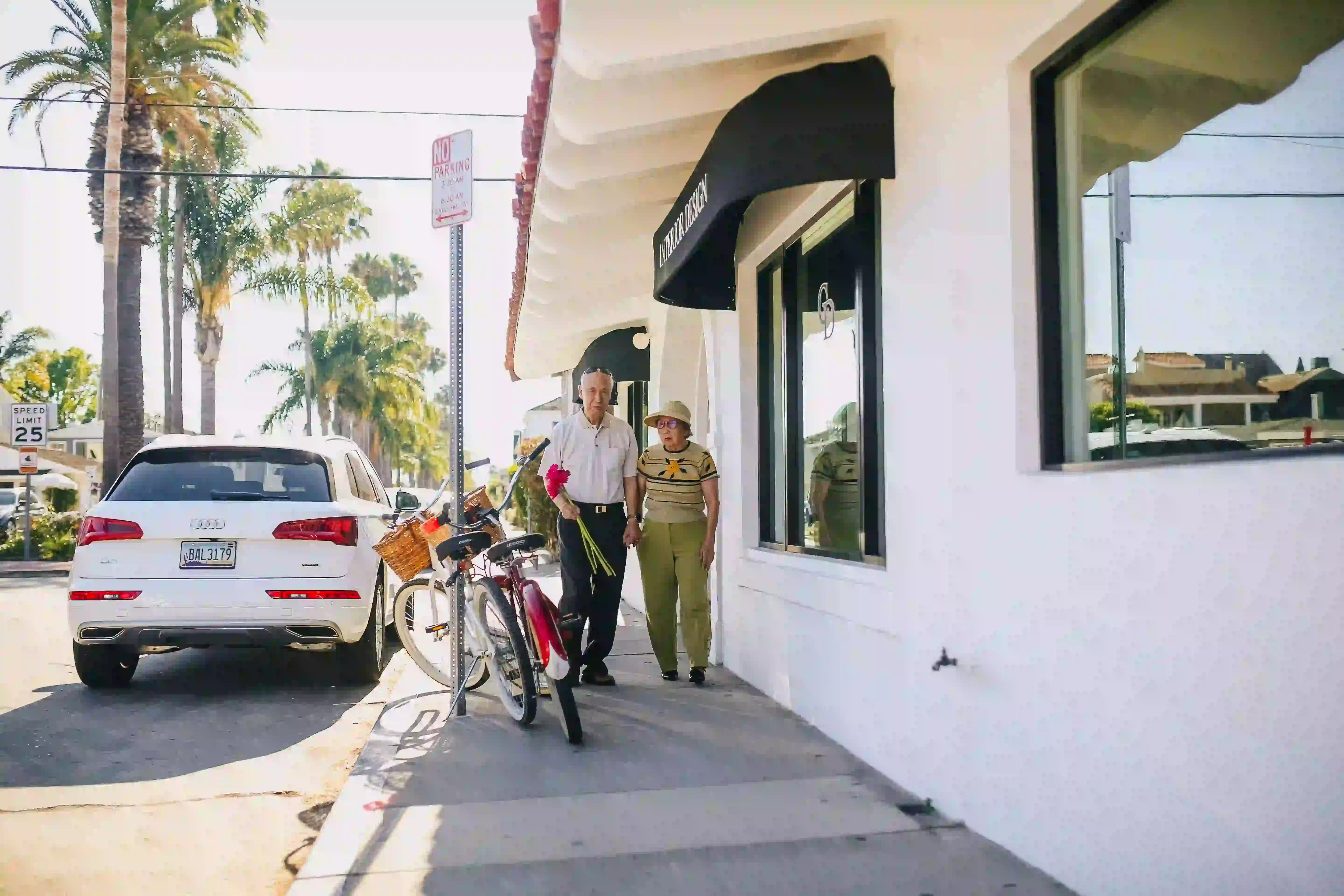 Elderly couple walking to the street.