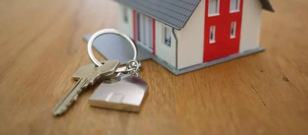 Small house toy with a keychain next to it